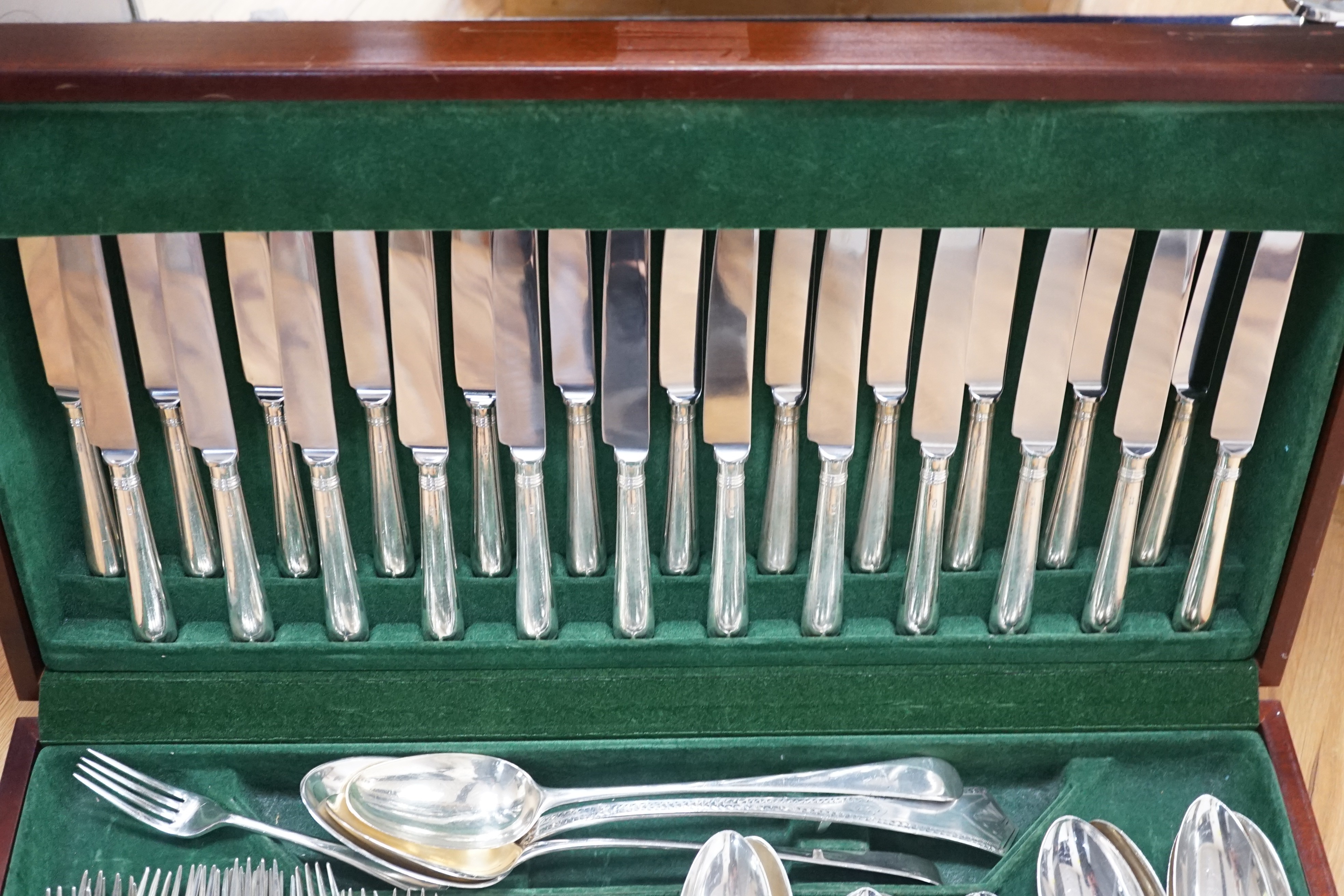 A part canteen of mainly 19th century and later silver cutlery, various patterns, dates and makers, comprising seventy eight items including modern table knives and one plated dessert fork, in a fitted wooden canteen